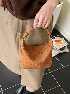 Vintage brown woven hobo bag for women, stylish crescent shoulder bag with zipper closure.