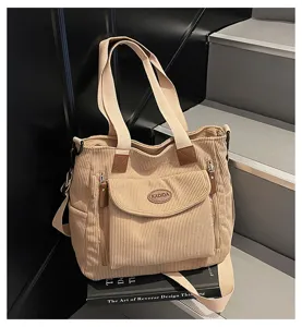 Casual corduroy tote bag for women, versatile shoulder handbag with double handles and pockets.