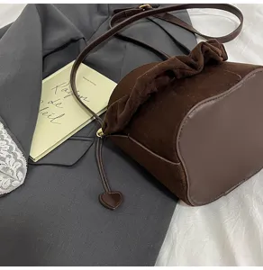 Brown suede bucket bag for women, chic gathered ruffle shoulder bag with heart charm.