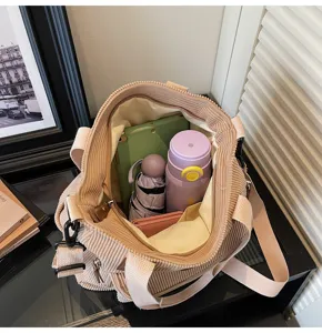 Detailed view of casual corduroy tote bag showing spacious interior capacity and pockets.