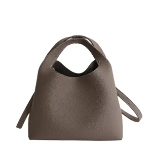 Minimalist top handle bucket bag for women, stylish taupe leather crossbody bag, 2026 new.
