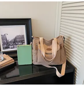 Casual corduroy tote bag for women, stylish shoulder bag with daily commuter design and front pocket.