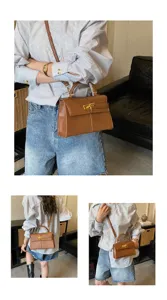 Élégant sac à main bandoulière marron pour femme avec détails de quincaillerie dorée.