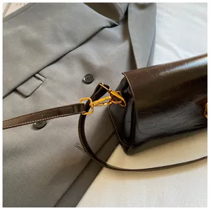 Dark brown shiny leather crossbody shoulder bag detail, stylish commute square bag.