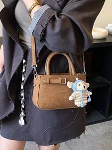 Retro brown PU leather crossbody bag, stylish women mini tote handbag with cute bear charm.