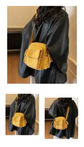 Stylish yellow crossbody camera bag for women, versatile shoulder bag for outdoor daily use.