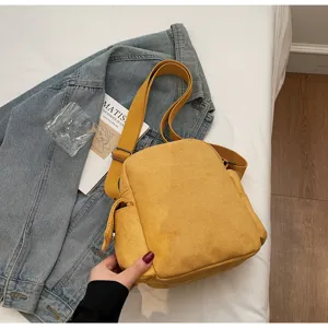 Casual yellow crossbody shoulder bag for women, versatile daily canvas camera bag style.