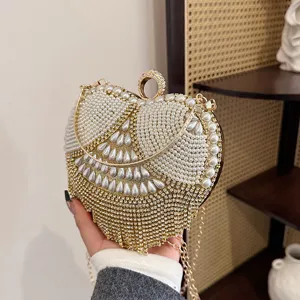 Elegant heart-shaped evening clutch bag adorned with pearls and sparkling rhinestones.