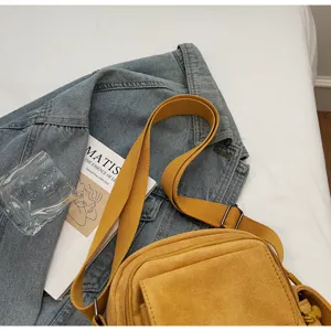 Yellow canvas crossbody shoulder bag detail, stylish casual daily outdoor fashion design.