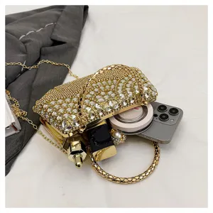 Rhinestone evening clutch bag detail showing spacious interior capacity with luxury style.