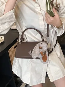 Korean style vintage frosted leather shoulder handbag with cute plush rabbit charm for women.