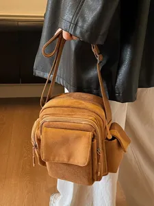 Fashionable brown suede crossbody camera bag with multiple pockets for women outdoor.