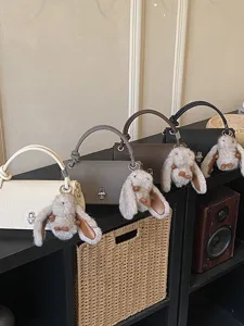 Minimalist frosted handbag with cute bunny charm, chic Korean style retro single shoulder bag.