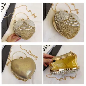 Heart-shaped evening bag for women, luxury pearl and rhinestone clutch with metal ring handle.