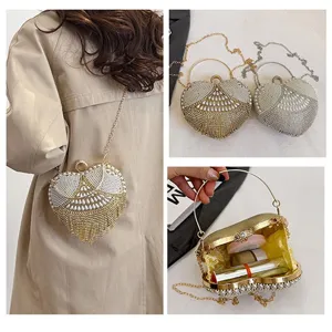 Heart-shaped rhinestone evening bag with pearls, stylish metal chain crossbody clutch for women.