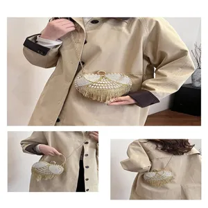 Heart-shaped pearl fringe evening bag with metal chain strap, stylish versatile clutch for women.