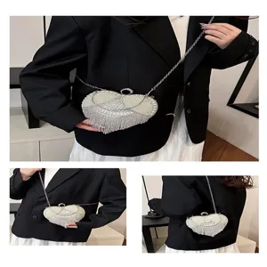 Heart pearl rhinestone evening bag detail view, highlighting fringe and crystal chain.