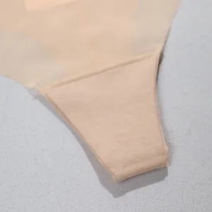 Close-up detail of women seamless thong underwear in nude color with breathable cotton crotch.