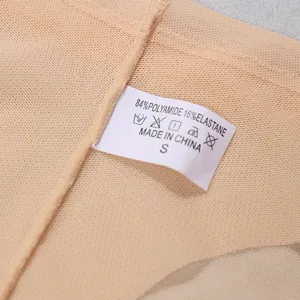 Detailed view of seamless thong underwear fabric and wash care label size S, breathable material.