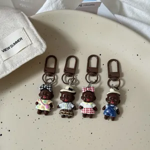 Quirky ugly-cute dark-skinned doll keychains, creative bag pendants and trendy accessories.