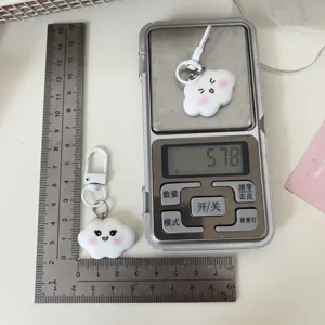 Cute kawaii cloud keychain detail view showing exact product size and weight measurement.