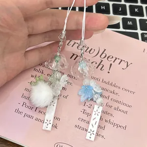 Cute handmade phone charm with glass wind chime and maple leaf design for bags and keys.