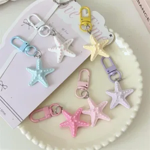 Cute 3D starfish keychain and bag pendant, pastel resin charm accessory for best friends.