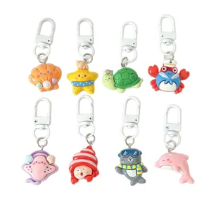 Cute marine animal keychains set, cartoon sea turtle crab dolphin charms for gifts.