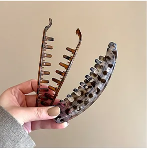 Leopard print banana hair clip for women, chic tortoise shell vertical hair claw styling.