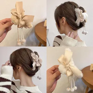 Cute plush bow hair claw clip with pearl tassels, soft faux fur hair accessories for women.