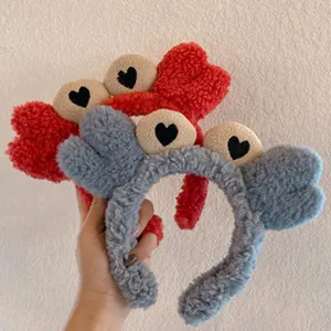 Cute plush headband with heart eyes, soft fuzzy texture, comfortable daily hair accessory detail.