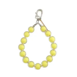 Yellow beaded keychain strap with metal clasp, stylish cute phone charm and earphone case decor.