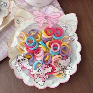 Cute candy-colored kids hair ties in cat bag, high elasticity mini rubber bands for girls.