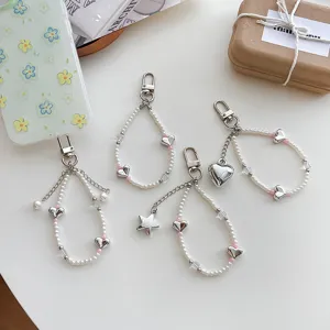 Korean sweet pearl silver heart star phone charm keychain set, flatlay product main image.