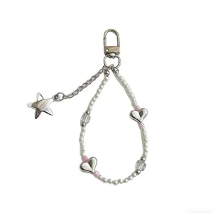 Korean sweet pearl heart star keychain phone charm, stylish cute accessory for bags and phones.
