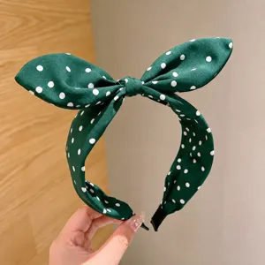 Retro green polka dot bow headband for women, wide brim elegant hair hoop for daily wear.