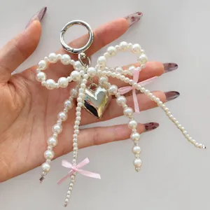 Pearl bow keychain bag pendant cute heart charm accessories stylish phone strap design