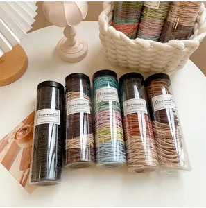 Clear canned colorful hair ties detail view, elastic rubber bands for ponytail daily styling.