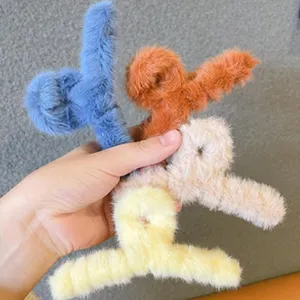 Plush koala claw clip details, soft fluffy hair accessories in multiple vibrant colors.