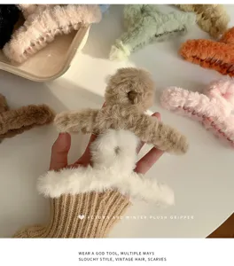 Oversized plush hair claw clip for women, soft winter shark clip for thick hair styling.
