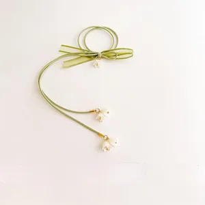 Laccio per capelli verde stile Mori fiocco muguetto, elegante elastico nappa floreale vista principale