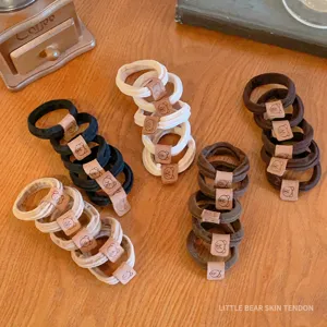 Elastici capelli senza cuciture con toppa in pelle d'orso, accessori per acconciature resistenti.