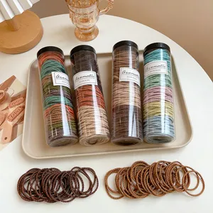 Canned colorful hair ties set, transparent storage tubes with elastic hair ropes for women daily styling.