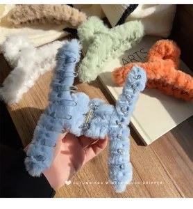 Oversized plush hair claw clip for women, thick hair winter fluffy shark hairpin accessory.