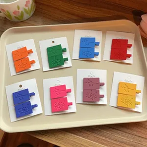 Colorful rectangular hair clips set with cute embossed design, perfect for daily styling.