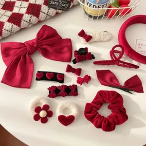 Chic red velvet hair accessories set including bows, claw clips, and scrunchies for styling.
