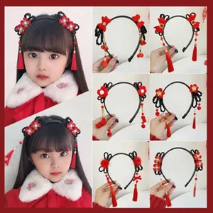 Chinese style kids hair hoop with red tassels and flowers, festive holiday hair accessories for girls.