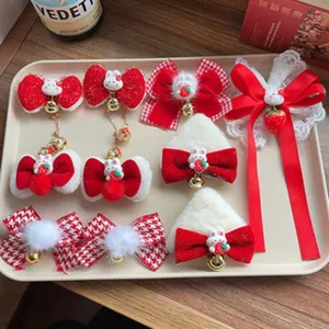 Detailed shot of red velvet hair clips featuring cute rabbit and strawberry charms with bows.