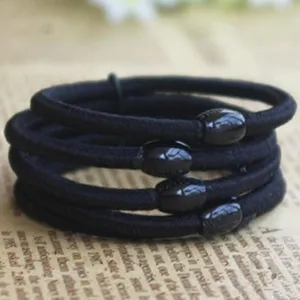 Elastici per capelli neri con perline decorative, supporto resistente per coda di cavallo.