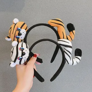 Plush animal headbands featuring cute tiger head and tail designs, perfect for daily styling.